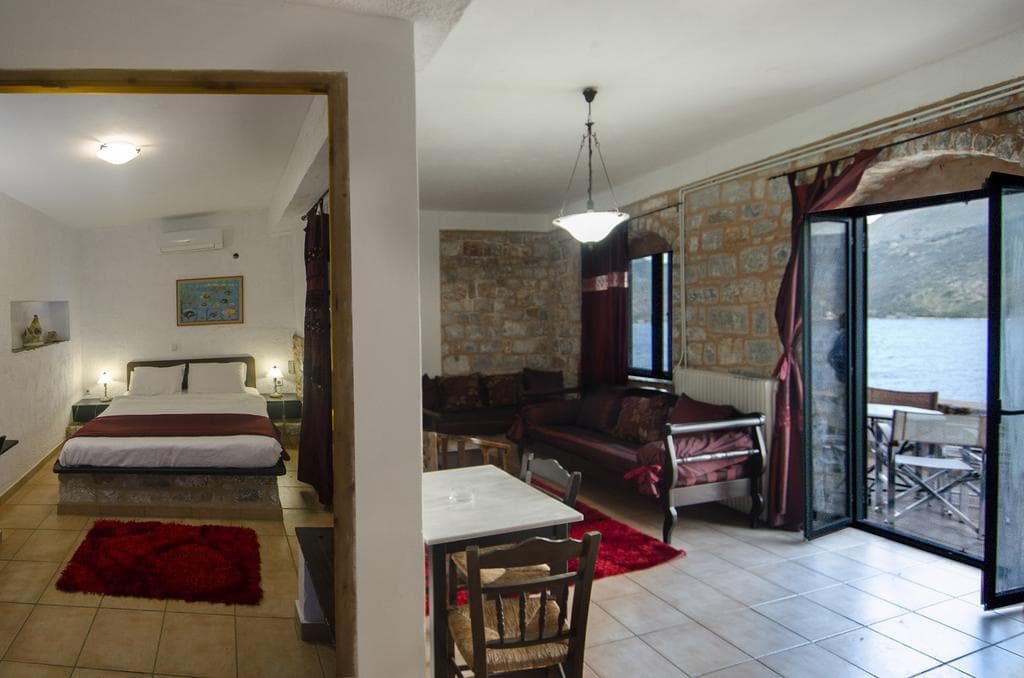 A studio interior with stone walls and a fireplace