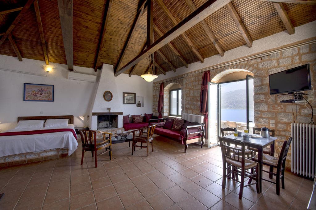 A studio interior with stone walls and traditional furniture
